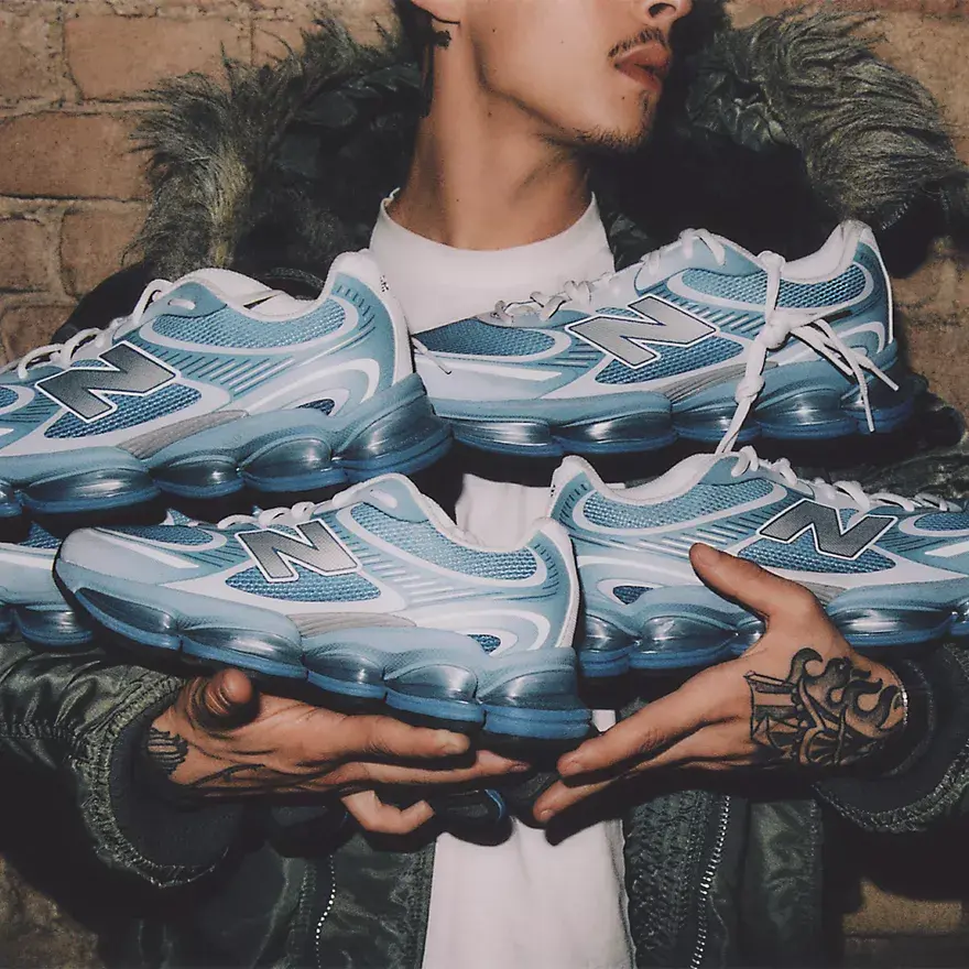 new balance abzorb 2000 man holding many shoes